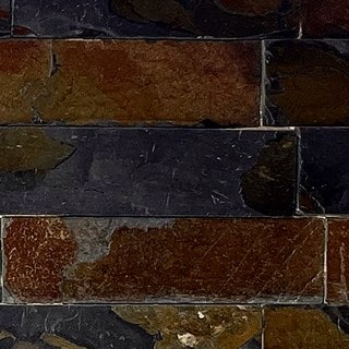 Tonos de Piedra Cortada Oxidada: grafito, óxido, mostaza, en un acercamiento de la muestra real